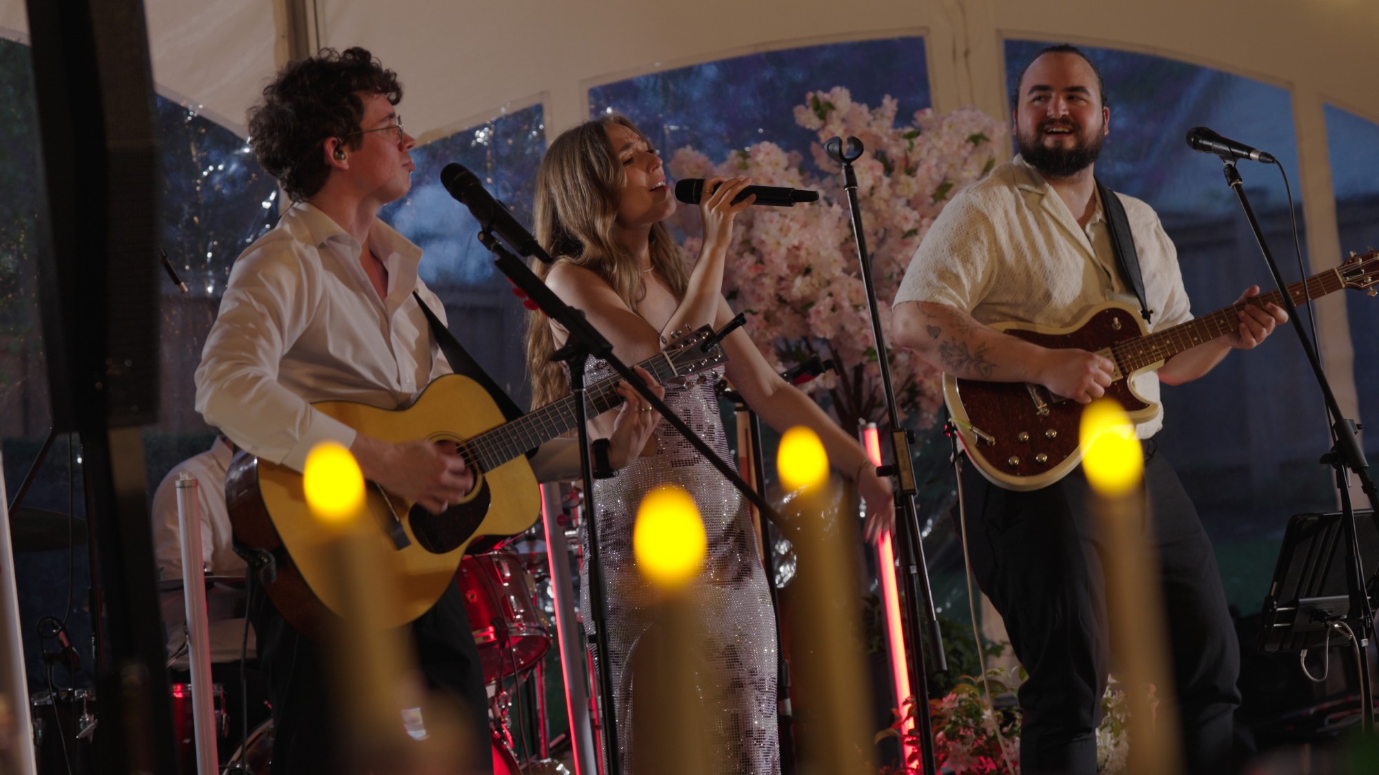 White Roses Entertainment performing live as a trio under a wedding tent